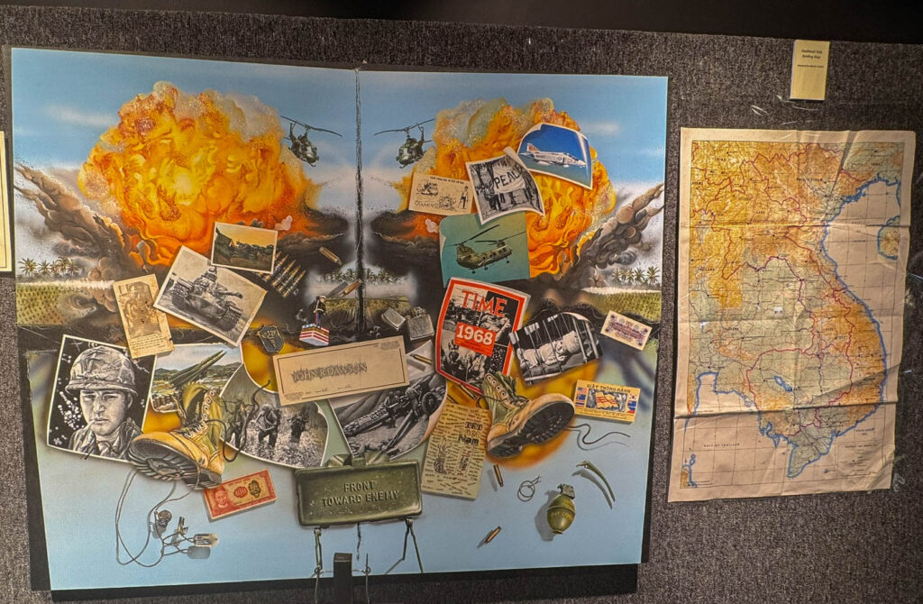 Vietnam Elegy by Denham Clements, a Marine veteran who served 13 months in Vietnam. The mixed-media work combines painted images and mementos from the war era as a tribute to Vietnam veterans and their families.