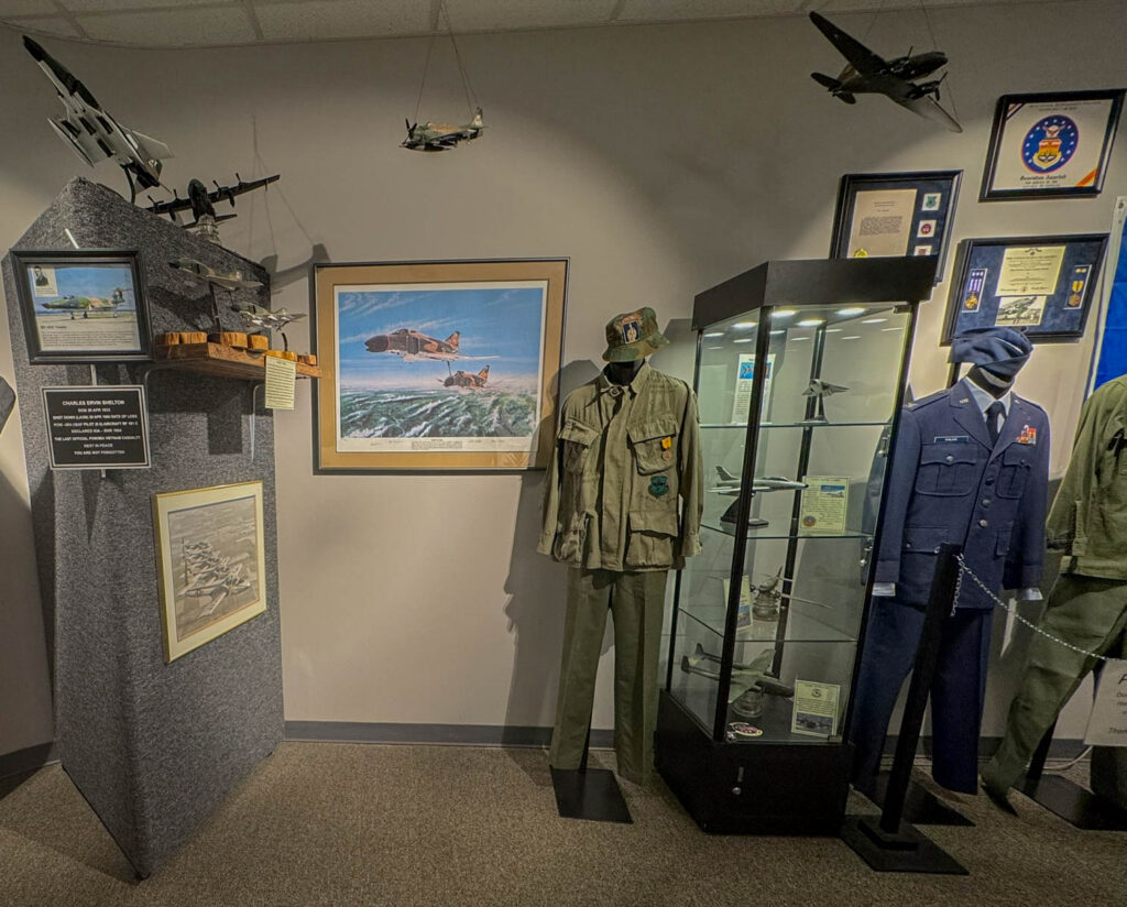 Military uniforms, aircraft models, and artwork on display inside the museum. The painting caught my eye because it depicts an F-4 Phantom, which my dad flew on 125 missions over North Vietnam.