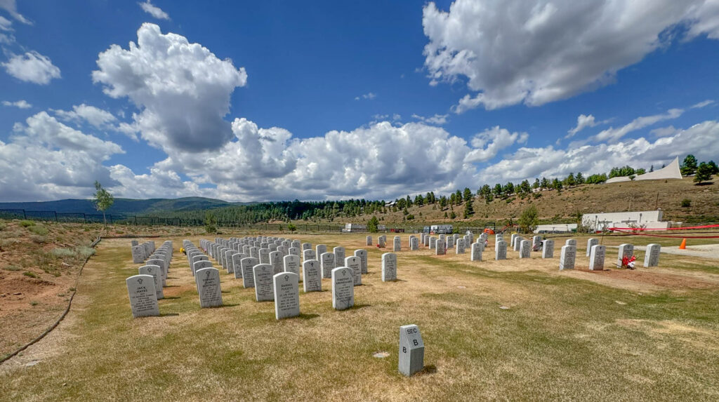 The State Veterans Cemetery at Angel Fire, with the Peace and Brotherhood Chapel visible on the hillside above.