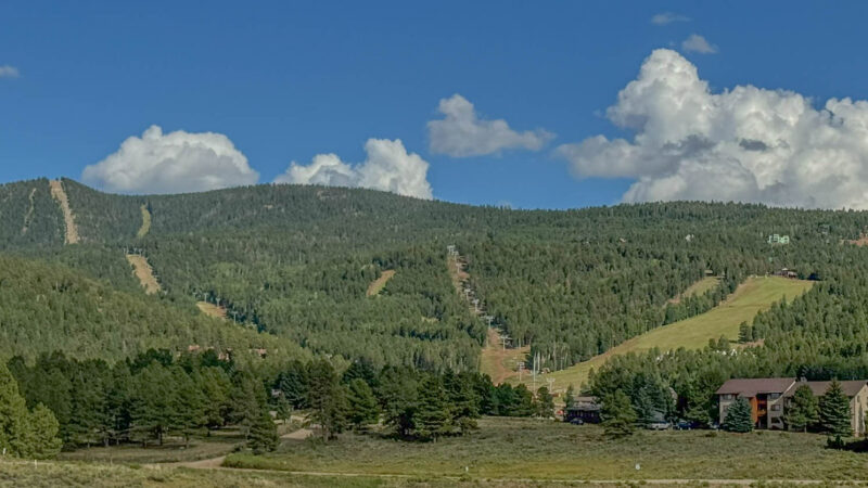 Angel Fire Resort in summer, where the ski slopes transform into hiking trails, mountain bike runs, and scenic chairlift rides.
