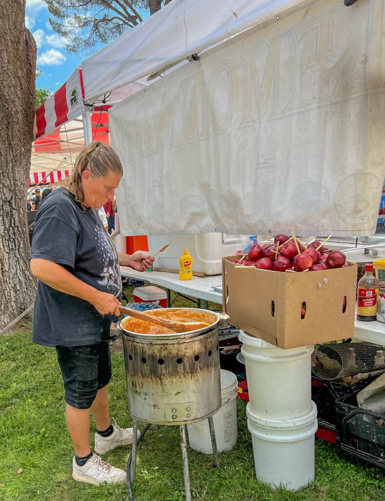 Caramel apples being made at one of the many food stands at the Great American Duck Race.