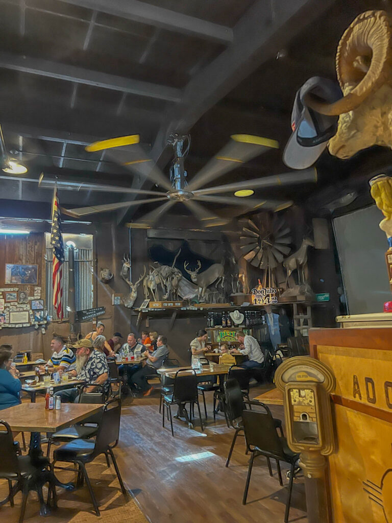 The main dining room at Adobe Deli, where the eclectic decorating continues.